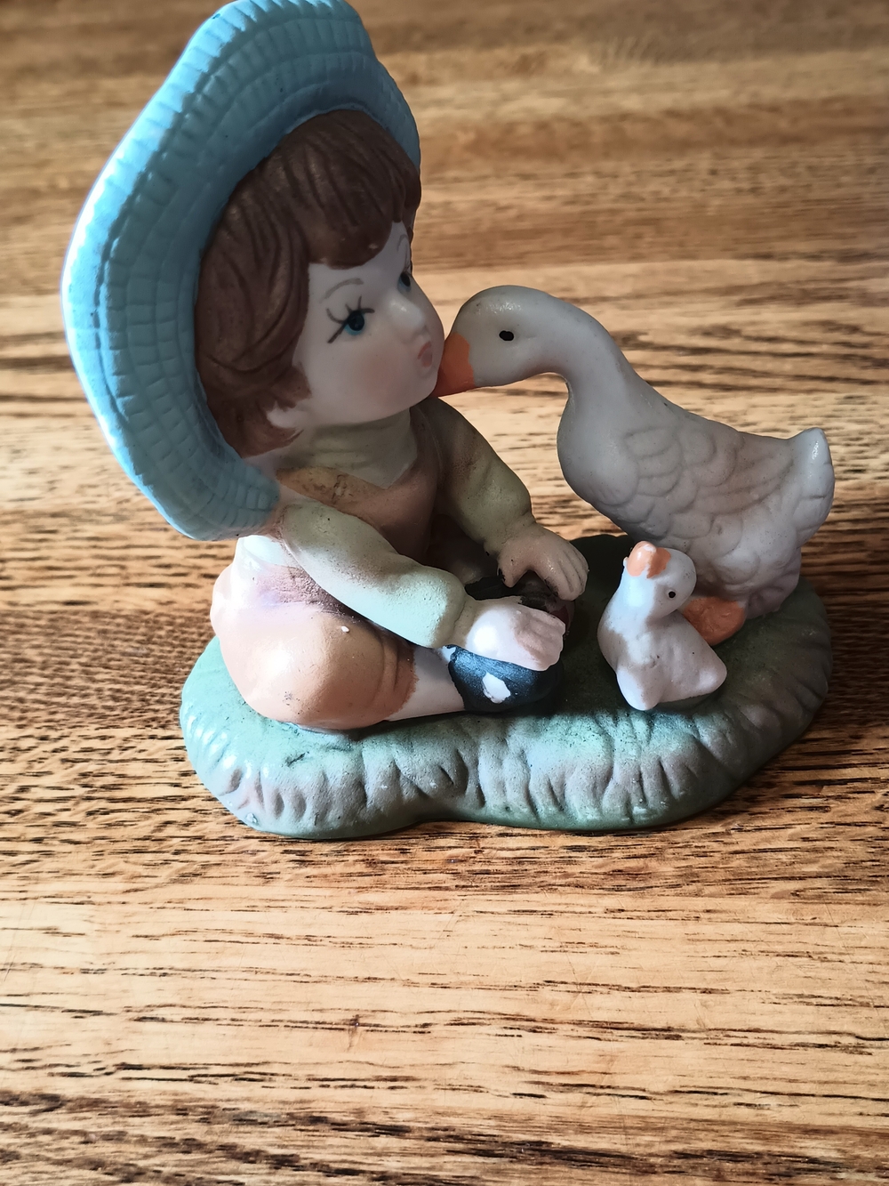 Hand-Painted Ceramic Boy and Geese Figurine in Blue and Green